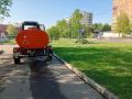 В Долгопрудном убирают дороги и поливают цветы на клумбах