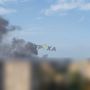 Дым поднимается после очередного прилета в Подольском районе Киева